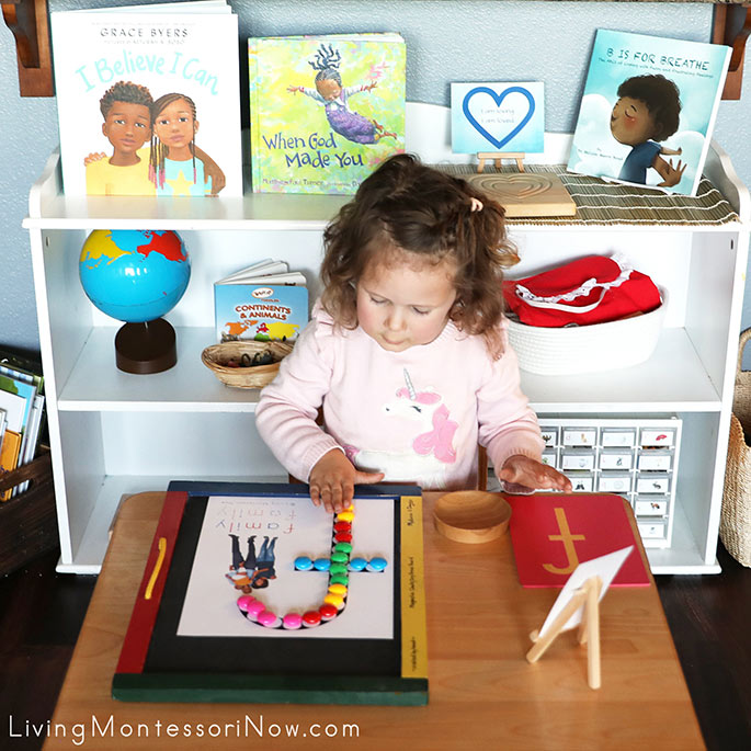 Admiring Her Magnet Work with F for Family Do-a-Dot Printable