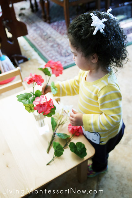 Arranging Flowers for Her Snack Table