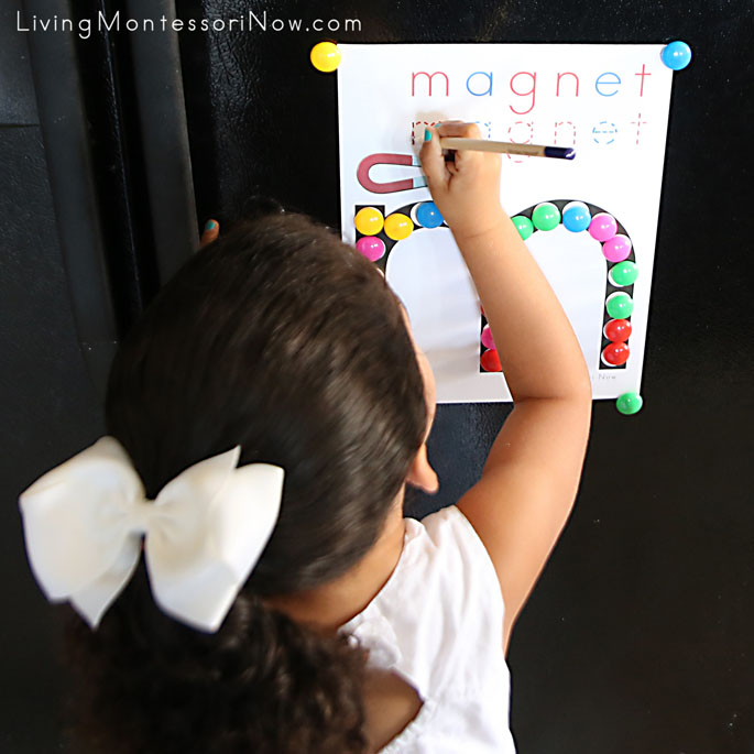 Tracing Letters in the Word "magnet" on Refrigerator